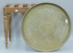 A mahogany stool and a brass tray. The former 50 cm long.
