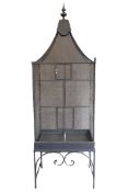 An early 20th century French wirework bird cage on stand. 222 cm high overall x 71 cm wide.
