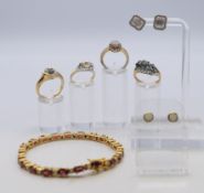A quantity of stone-set yellow metal jewellery including a tennis bracelet,