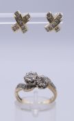 A 9 ct gold diamond crossover ring marked .25 (carat) and a pair of cross form earrings.