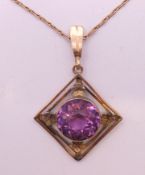 A 9 ct gold pendant on a 9 ct gold chain. Pendant 2.5 cm high, chain 40 cm long. 7.
