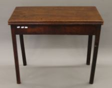 A 19th century mahogany folding tea table. 86 cm wide.