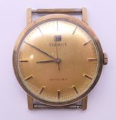 A Tissot 9ct gold gentlemen's wristwatch. 3.25 cm diameter.