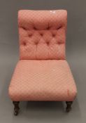 A Victorian pink upholstered nursing chair. 57 cm wide.