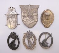 Four German Orders and two German shoulder plates. Largest shoulder plate 7.5 cm high.