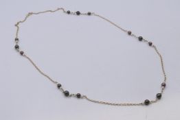 A 9 ct gold and pearl necklace. 80 cm long.