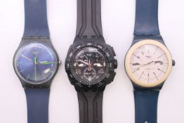 A Swatch Chrono Access SUKB400 Mister Twin wristwatch; a Swatch Sistem Navy SUTN400 wristwatch;