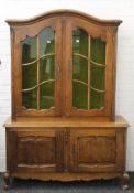 A Continental oak display cabinet. 123 cm wide x 175 cm high.
