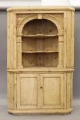 A 19th century pine corner cupboard. 120 cm wide x 187 cm high.
