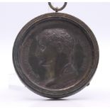 A Napoleon lead medallion in a metal pendant frame. 7 cm diameter.