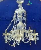 A cut glass chandelier 65 cm high.
