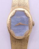 An 18 ct gold DeLaneau ladies' wristwatch, the reverse stamped 1293 V, in DeLaneau box. Dial 2.