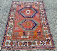 A Middle Eastern red ground rug. 234 x 160 cm.