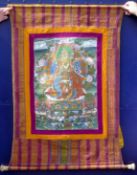 A Tibetan thangka. 87 cm wide.