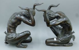 A pair of patinated bronze Blackamoor tray/table supports. Each 51 cm high.