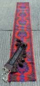 A red ground rug and a camel rug. The latter 145 cm x 16 cm.