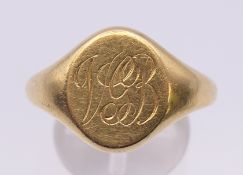 An 18 ct gold gentleman's ring, engraved with initials. Ring size Y. 12.7 grammes.