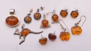 A small quantity of amber jewellery to include five pairs of earrings and two pendants.