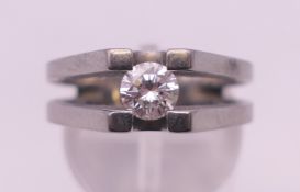 A titanium and diamond solitaire ring. Ring size M/N.