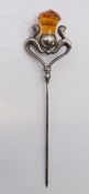 An Art Nouveau silver hat pin formed as a thistle. 9.5 cm high.