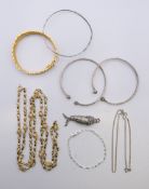 A quantity of various silver bangles, a silver bracelet, a silver chain,