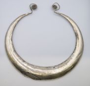 A large silver torque necklace (possibly Chinese Maio tribe).