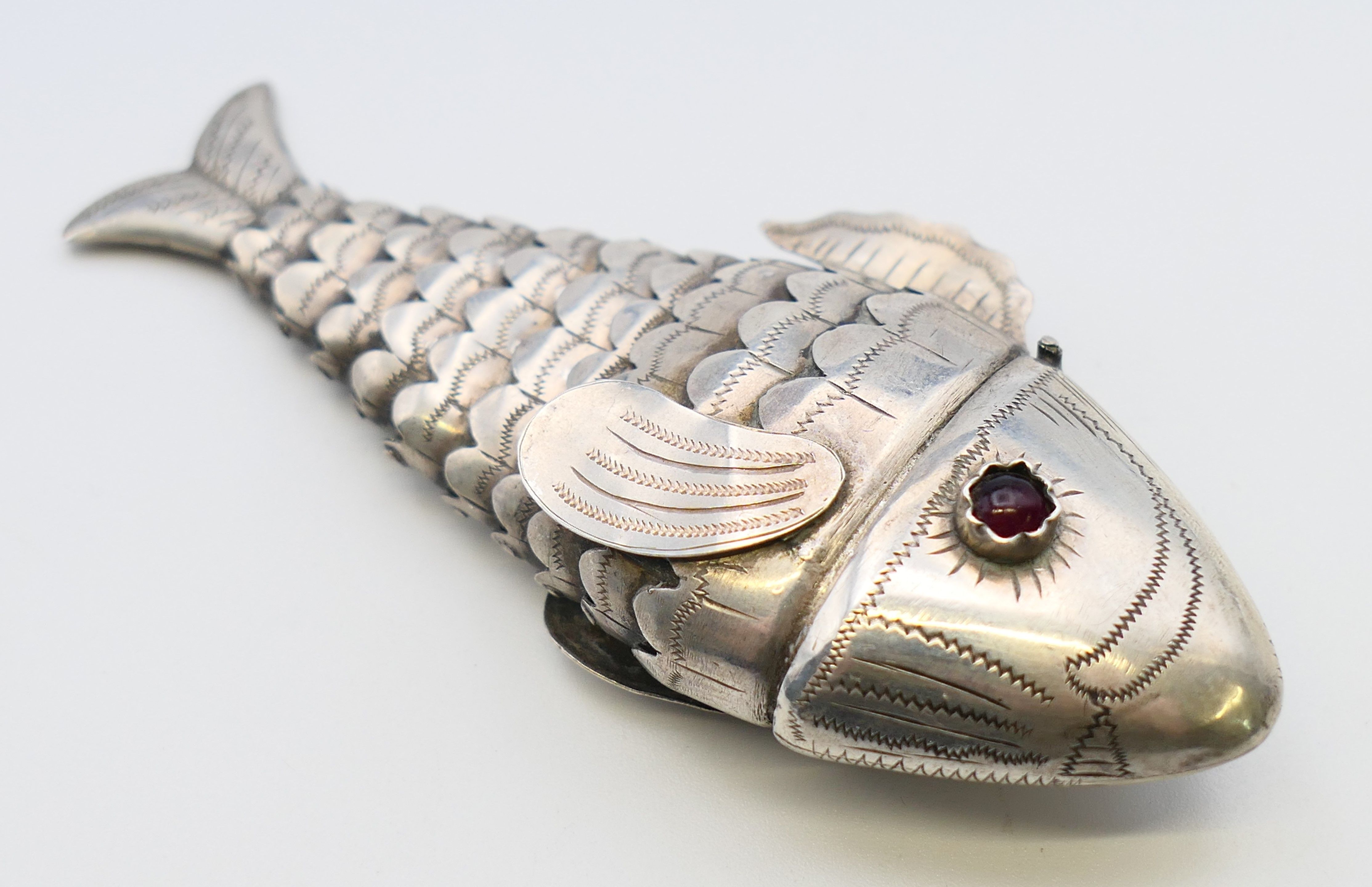 An eastern unmarked silver reticulated fish-form pill box. 9 cm long. - Image 2 of 4