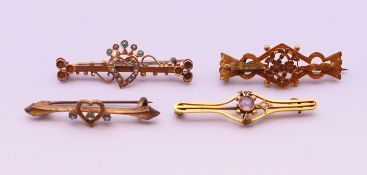 Three Victorian 9 ct gold bar brooches (5.7 grammes total weight) and a gold-plated bar brooch.