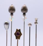 A collection of hatpins. The largest 12.5 cm high.