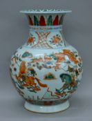 A Chinese porcelain vase decorated with warriors. 46 cm high.