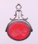 A Georgian unmarked silver intaglio swivel fob, carved to one side with a portrait bust. 4.
