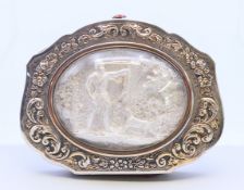 A Continental unmarked white metal-clad purse depicting a hunting scene. 7.5 cm wide.