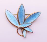 A Scandinavian silver and enamel leaf-form brooch. 4.5 cm wide.
