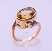 A 9 ct gold citrine ring. Ring size N. 6.3 grammes total weight.