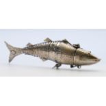 An Eastern unmarked silver reticulated fish-form box. 14 cm long.