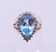 A 9 ct white gold and blue topaz ring. Ring size O.