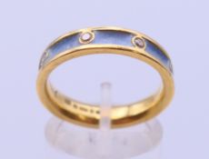 An 18 ct gold diamond and enamel wedding band. Ring size P. 5.6 grammes total weight.