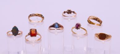 Eight 9 ct gold rings and a 15 ct gold ring. 16.1 grammes total weight.