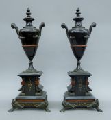 A pair of marble and bronze urns. Each 45 cm high.
