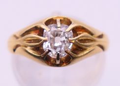 An 18 ct gold and diamond solitaire ring, the stone spreading to just under 0.75 ct. Ring size M. 5.