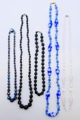 Three vintage black glass necklaces,
