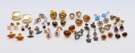 A quantity of various gold and other earrings. The amber-set circular pair 1 cm diameter.
