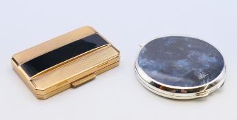 A vintage Stratton compact and another. The former 8 cm wide.