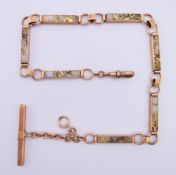 A 9 ct gold and gold flecked quartz watch chain. 38 cm long. 46.8 grammes total weight.