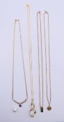 Three 9 ct gold pendants on 9 ct gold chains and a 9 ct gold necklace.