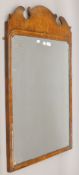 A 19th century walnut-framed mirror. 67 x 99 cm.