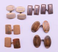 A pair of 9 ct gold cufflinks, a pair of 9 ct gold and silver cufflinks,