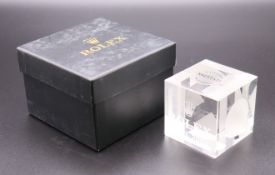 A Rolex Basel 2004 square clear glass paperweight with label for Venezia Salviati,