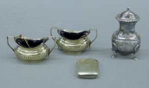 A silver-plated vesta case, two silver-plated salts and a silver-plated pepper. The latter 9.