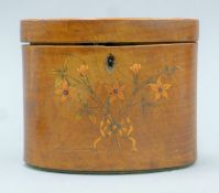 A 19th century inlaid mahogany oval tea caddy. 14 cm wide.